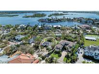 Aerial view of waterfront lot and surrounding homes at 838 Norsota Way, Sarasota, FL 34242