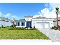 Single-story home with gray roof, white walls, and blue shutters at 15625 San Lazzaro Ave, Bradenton, FL 34211