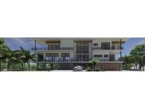 Modern three-story home with attached garage and sleek design at 0 Casey Key Rd, Nokomis, FL 34275