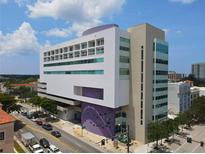 Modern building exterior featuring a unique architectural design with balconies and ample windows at 1990 Main St # 15, Sarasota, FL 34236