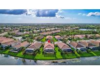 Aerial view of single Gathering home in a quiet residential neighborhood at 335 River Enclave Ct, Bradenton, FL 34212