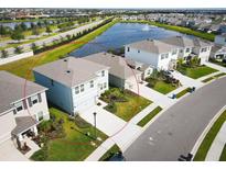 Aerial view of two-story home in residential area at 5262 Grove Mill Loop, Lakewood Ranch, FL 34211