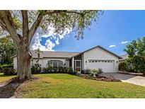 Charming one-story home with a well-manicured lawn at 5721 31St E Ct, Bradenton, FL 34203