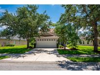 Two-story home with attached garage and landscaped yard at 6227 Blue Runner Ct, Lakewood Ranch, FL 34202