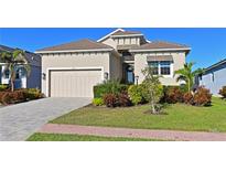 Attractive single-story home with a two-car garage and well-manicured landscaping at 6248 Champions Row, Bradenton, FL 34210