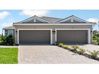 Charming home featuring a two-car garage and well-manicured landscaping at 16112 Isola Pl, Bradenton, FL 34211