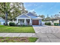 Charming craftsman style home with a spacious front yard at 2110 Hawthorne St, Sarasota, FL 34239