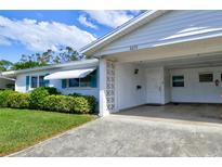 House exterior with carport and landscaping at 6079 Coral Way, Bradenton, FL 34207