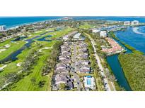 A beautiful aerial view showcases the property's proximity to the golf course and nearby Gulf beaches at 2155 Harbourside Dr # 804, Longboat Key, FL 34228