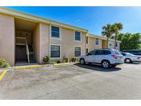 Exterior view of a two-story building with parking area in front, showing multiple units at 6309 Manatee W Ave # 6309, Bradenton, FL 34209