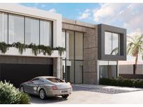 Modern two-story home with sleek design and a gray Bentley in driveway at 1640 Waldemere St, Sarasota, FL 34239