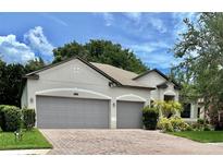 Two-story house with a two-car garage and well-maintained landscaping at 2271 50Th Street E Cir, Palmetto, FL 34221