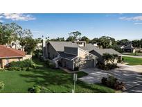 Two-story home with attached garage and landscaped yard at 3410 Avenida Madera # B, Bradenton, FL 34210