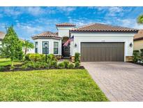 Single-story home with landscaping and driveway at 6249 Mesa Gln, Bradenton, FL 34203