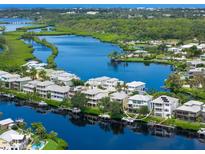 Aerial view of waterfront home with private dock and boat at 741 Shakett Creek Dr, Nokomis, FL 34275