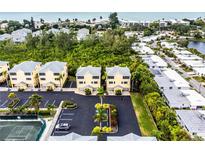 Aerial view of a waterfront condo community at 619 Cedars Ct, Longboat Key, FL 34228
