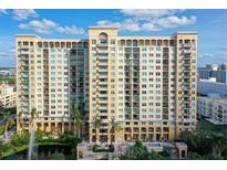 Multi-story building with balconies and water view at 750 N Tamiami Trl # 302, Sarasota, FL 34236