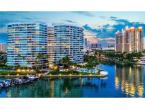 Stunning aerial view of waterfront high-rise building at sunset at 888 Blvd Of The Arts # 1701, Sarasota, FL 34236