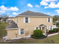 Charming multi-story home with neutral siding and white trim details on a sunny day at 14847 Skip Jack Loop, Lakewood Ranch, FL 34202