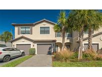 Two-story townhome with attached garage and landscaping at 15221 Lyla Ter, Lakewood Ranch, FL 34211