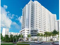 Modern high-rise building with sleek design and waterfront views at 301 Quay Commons # 811, Sarasota, FL 34236