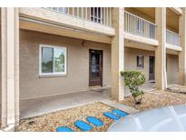 Condo building exterior showcasing entrance and landscaping at 3532 Lake Bayshore Dr # K117, Bradenton, FL 34205
