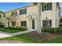 Well-maintained townhouse with green door and landscaping at 341 Cape Harbour Loop # 108, Bradenton, FL 34212