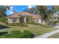 One-story home with attractive landscaping and a two-car garage at 8128 Collingwood Ct, University Park, FL 34201