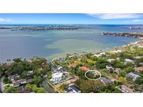 Aerial view of waterfront property with a lot and surrounding houses at 1616 North Dr, Sarasota, FL 34239