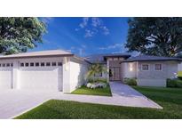 Two-car garage and walkway to front entrance of a single-story home at 24480 Cabana Rd, Punta Gorda, FL 33955
