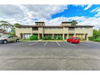 Front view of a townhouse community with parking at 4477 Sandner Dr, Sarasota, FL 34243