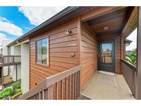 Exterior view of condo building showcasing wood siding and private entrance at 7135 27Th W Ave # 7135, Bradenton, FL 34209