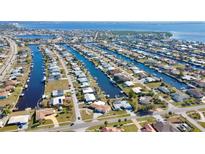 Aerial view of canal-front property with private backyard at 104 Leland Se St, Port Charlotte, FL 33952