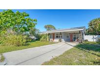 Cute bungalow with covered carport, and a fenced-in backyard at 2111 Outer Dr, Sarasota, FL 34231