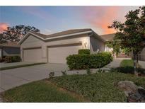 Attractive villa with two-car garage and well-manicured landscaping at 4209 Cascade Falls Dr, Sarasota, FL 34243