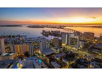 Stunning aerial view of the city skyline at sunset, showcasing the property's prime location at 1335 2Nd St # 301, Sarasota, FL 34236