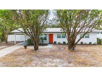 Charming single story home with a freshly painted exterior and a well maintained lawn at 3188 Bay St, Sarasota, FL 34237