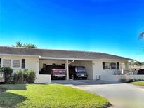 Two-car carport, and well-maintained lawn at 390 301 W Blvd # 30B, Bradenton, FL 34205