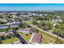 Aerial view of single-story home with surrounding landscape at 2431 Golf Course Dr # 703, Sarasota, FL 34234