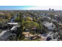 Aerial view of a waterfront home with a spacious yard and private dock at 506 Treasure Boat Way, Sarasota, FL 34242