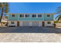 Newly constructed duplex boasts modern design, two-car garages, and attractive landscaping at 303 65Th St # A, Holmes Beach, FL 34217