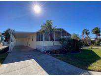Well-maintained manufactured home with carport and screened porch at 4851 W Gandy Blvd # 5Pa, Tampa, FL 33611