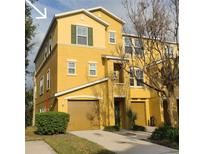 Beautiful 3 story yellow townhome with 2 car garage at 7321 Black Walnut Way, Lakewood Rch, FL 34202