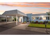 Cute light blue condo with carport and well-manicured landscaping at 3856 Trophy Blvd # 2, New Port Richey, FL 34655