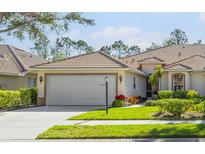 Charming single-story home with a well-manicured lawn and a two-car garage at 4316 Callista Ln, Sarasota, FL 34243