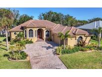 Beautiful one-story home with tile roof and lush landscaping at 1607 Landfall Dr, Nokomis, FL 34275