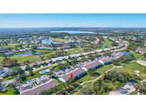 Aerial view of condo community near golf course and lake at 6713 Stone River Rd # 205, Bradenton, FL 34203