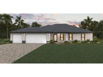 Single-story home with a two-car garage and landscaped front yard at 4880 Wilcox Ave, North Port, FL 34288