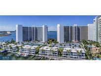Luxury waterfront community with multiple buildings, tennis courts, and marina at 555 Quay Cmn # 705, Sarasota, FL 34236