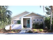 Charming craftsman style home with a landscaped front yard and walkway at 1421 14Th N St, St Petersburg, FL 33704